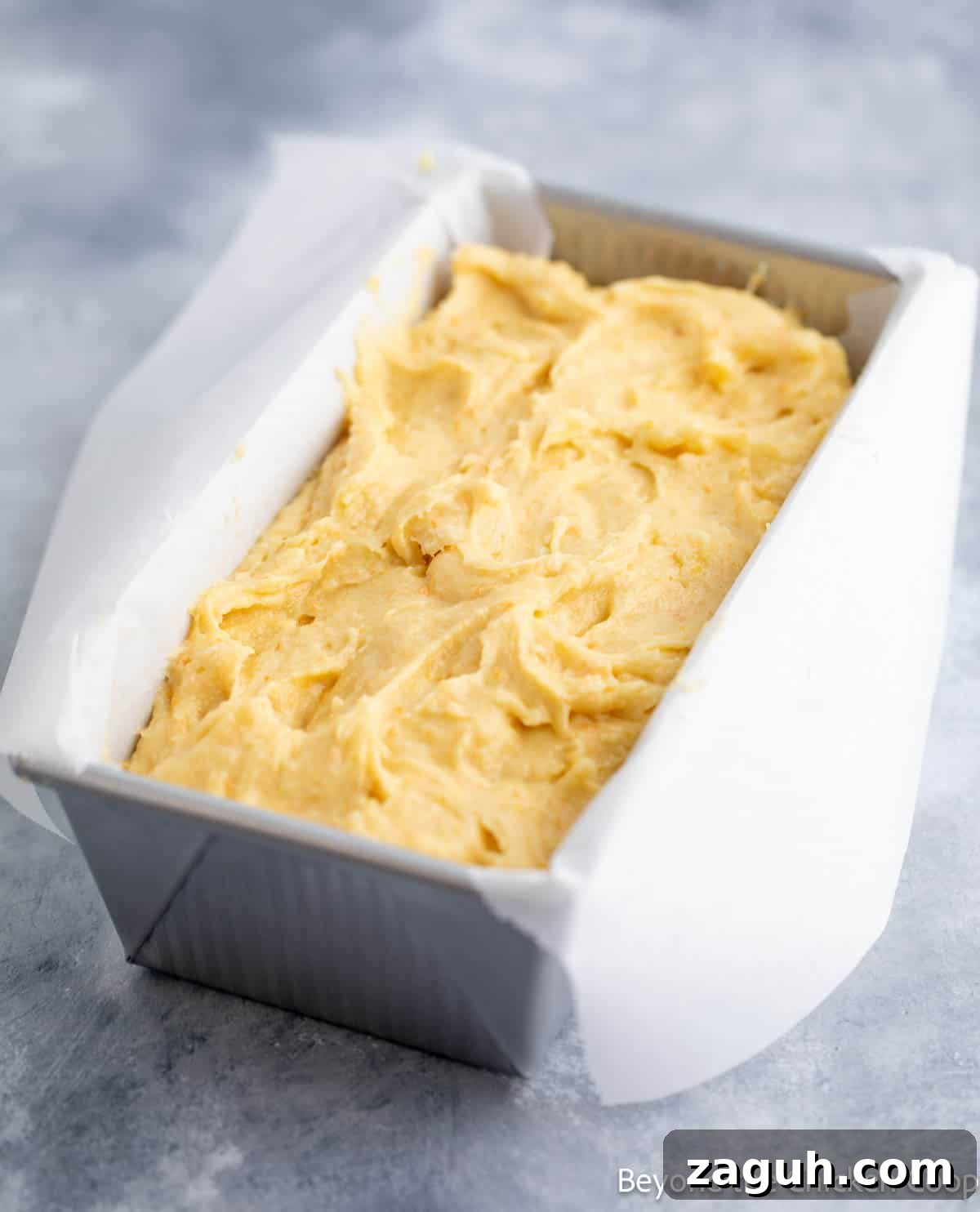 Moist Orange Pound Cake Recipe with Zesty Citrus Glaze 8 Cake batter in a loaf pan.