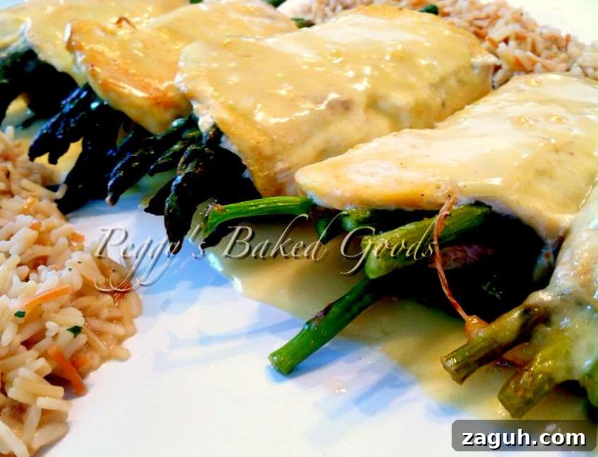 Stuffed Chicken Roulade Roll-Ups: Savory Dinner Recipe 3 Chicken Roll-Ups (roulade), tender pieces of chicken filled with spinach, asparagus, mushrooms, and cheese then rolled and baked, and served with a creamy Hollandaise sauce and easy mushroom pilaf rice.