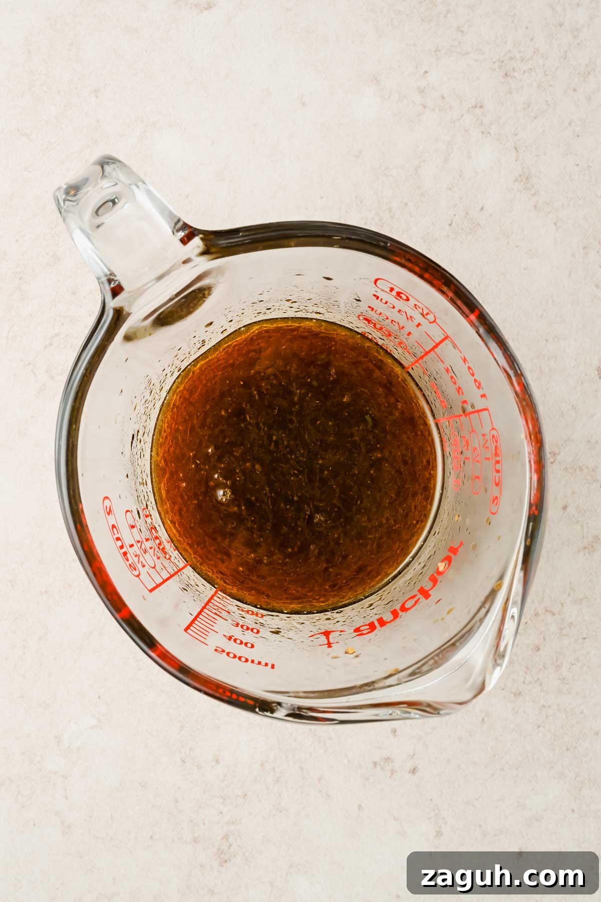 upgraded ramen sauce in glass beaker.