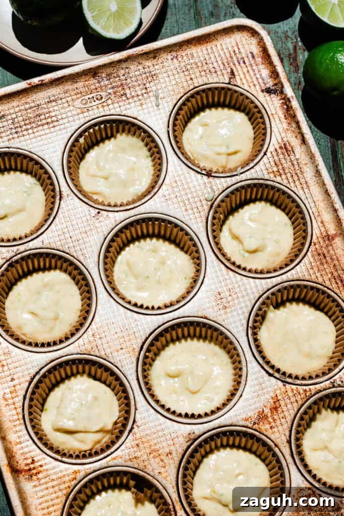 Key Lime Cupcakes with Tangy Lime Curd Filling 7 An overhead photo of the cupcake batter in the pan, ready for the oven.