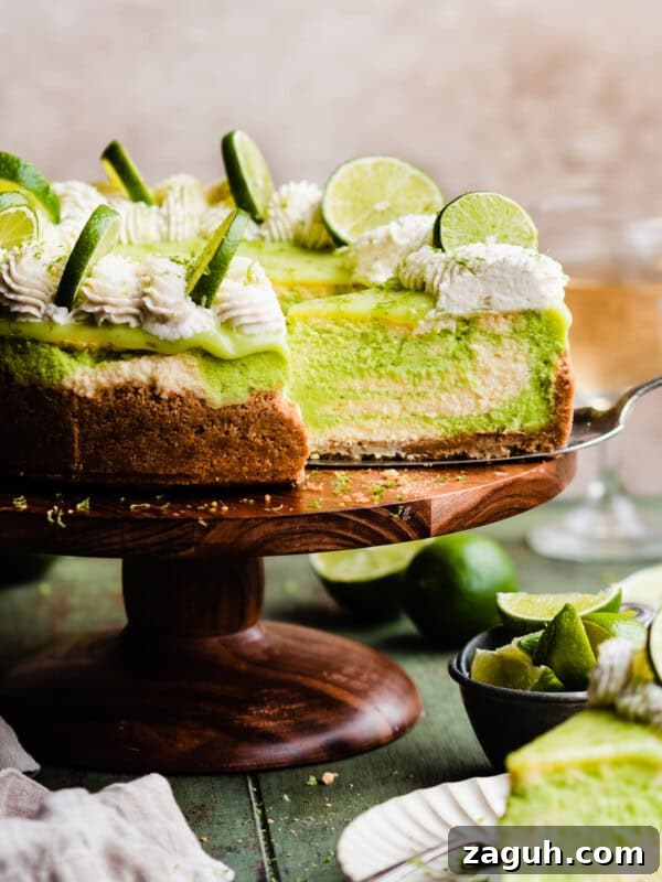 Key Lime Cupcakes with Tangy Lime Curd Filling 12 The sliced key lime cheesecake on a cake stand.