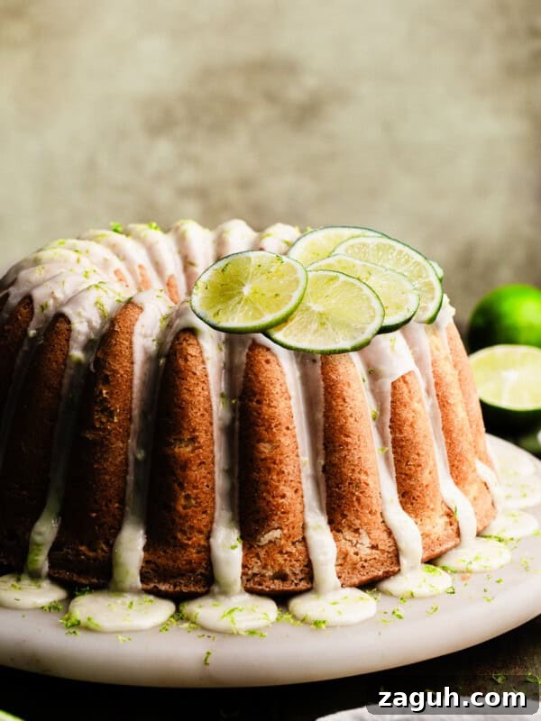 Key Lime Cupcakes with Tangy Lime Curd Filling 15 The glazed key lime bundt cake on a marble cake plate.