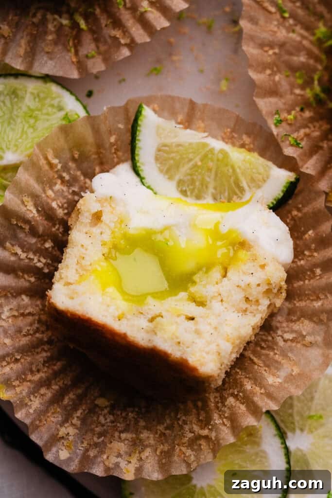 Key Lime Cupcakes with Tangy Lime Curd Filling 3 A bird's eye view of half a lime cupcake, showing the lime curd filling inside.