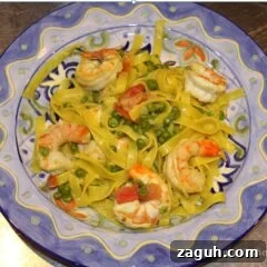 fettuccine with prawns, peas, tomatoes and cream sauce