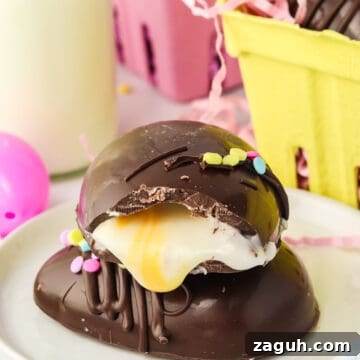 How to Make Copycat Cadbury Creme Egg Candy at Home 13 A chocolate dessert with a glossy exterior and a creamy filling, mimicking Copycat Creme Egg, topped with sprinkles, presented on a plate with an Easter candy-inspired festive background.
