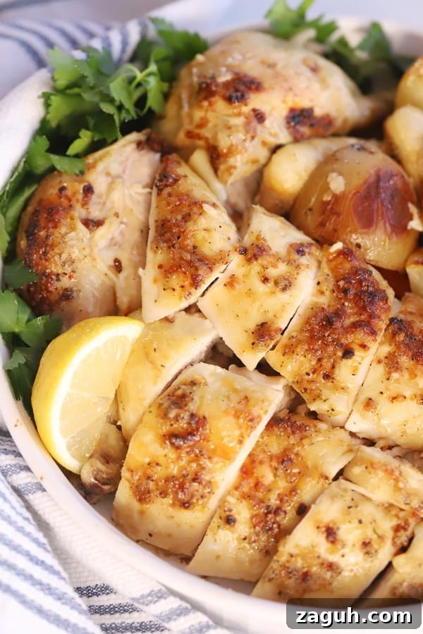 Whole roasted chicken cut into pieces and sitting in a bowl.