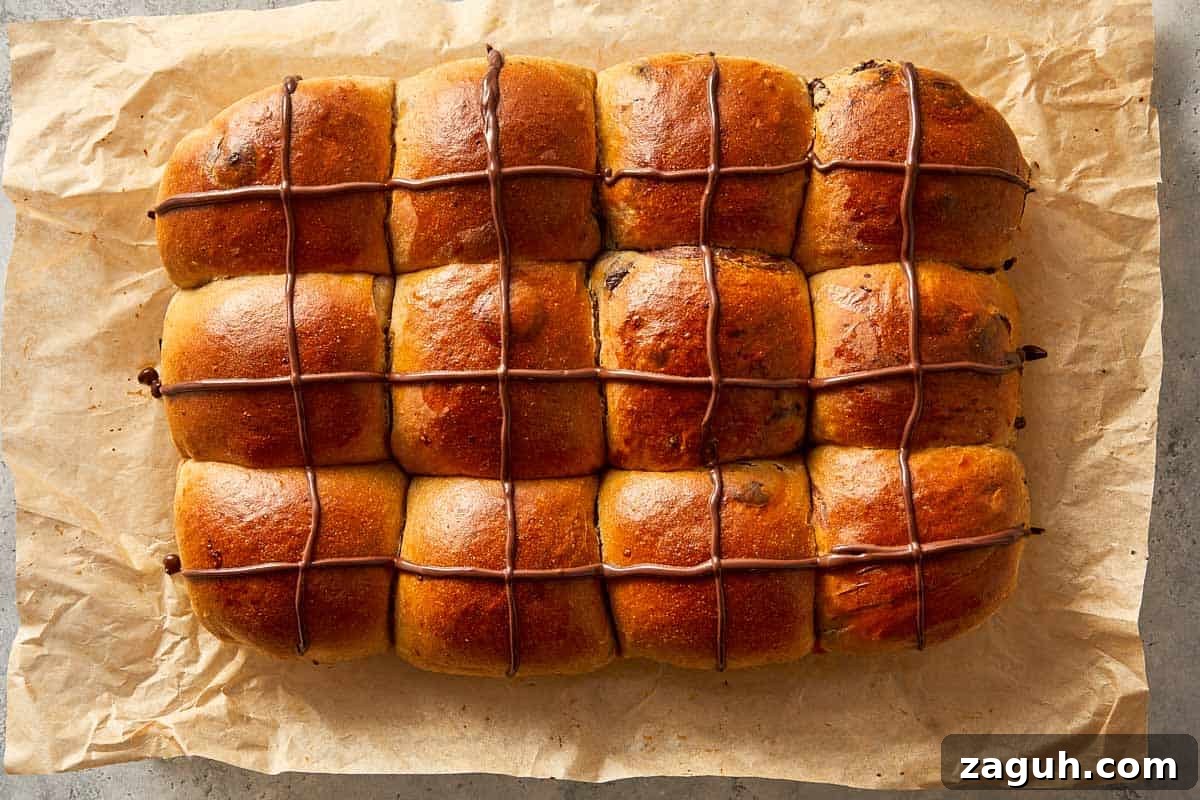 baked chocolate hot cross buns with chocolate crosses and glaze