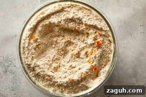 dry ingredients with chocolate chips and spices mixed in a bowl