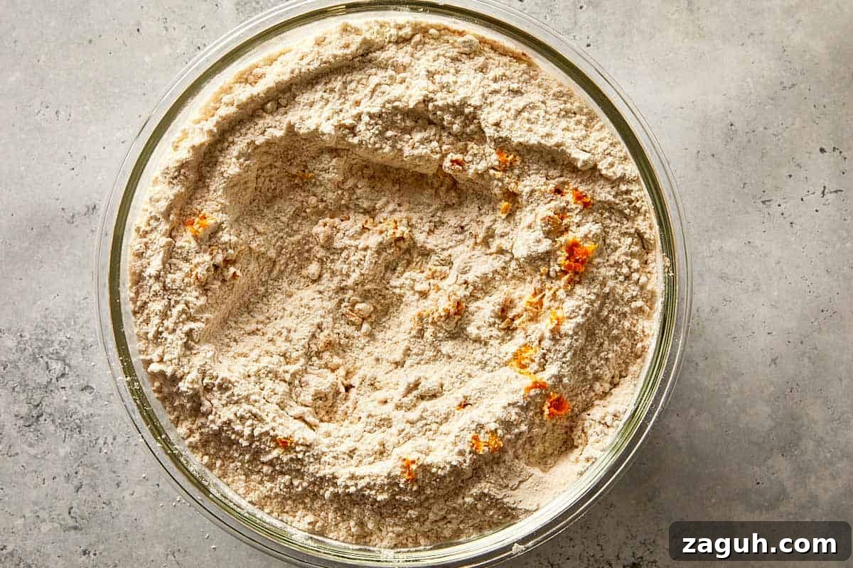 dry ingredients with chocolate chips and spices mixed in a bowl