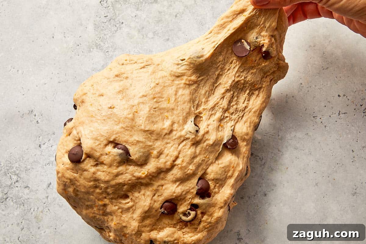 kneading dough until smooth and elastic texture forms