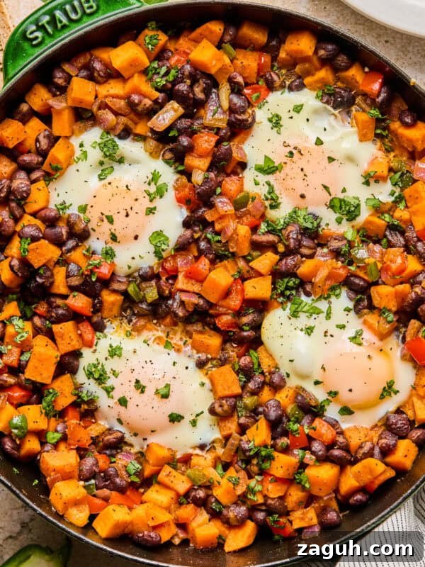 Sweet potato breakfast hash with black beans in skillet.