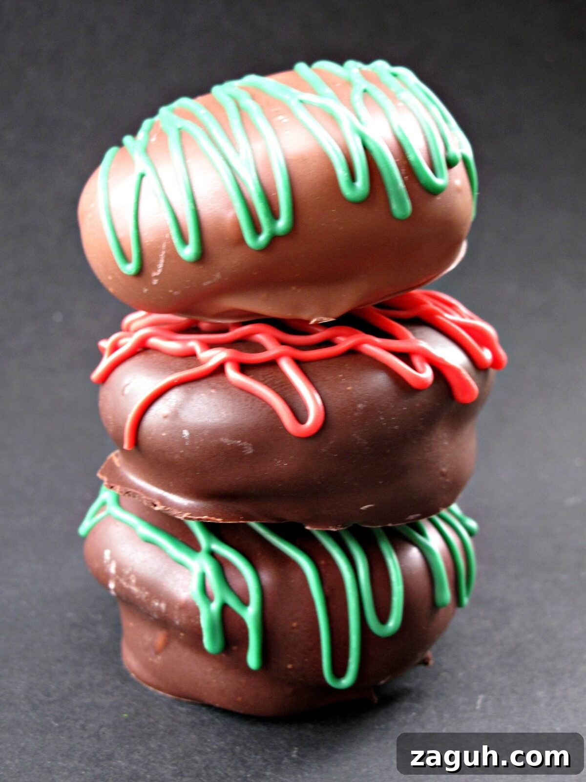 Chocolate Marshmallow (Mallomar) Cookies- This cookie is the first to be grabbed on holiday platters! A graham cracker base topped with a marshmallow and coated in chocolate. Drizzle with colors to match your holiday! | The Monday Box Stack of cookies.