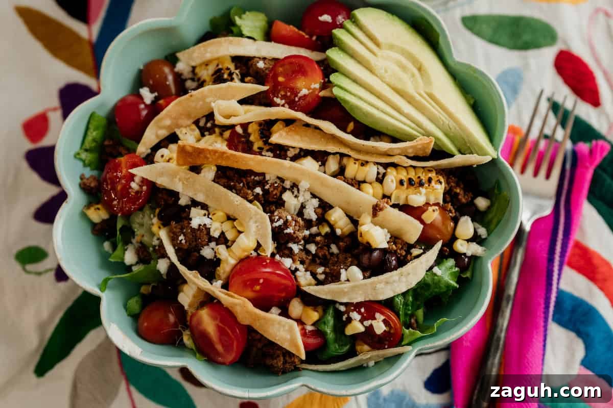 Taco salad in a turquoise bowl 