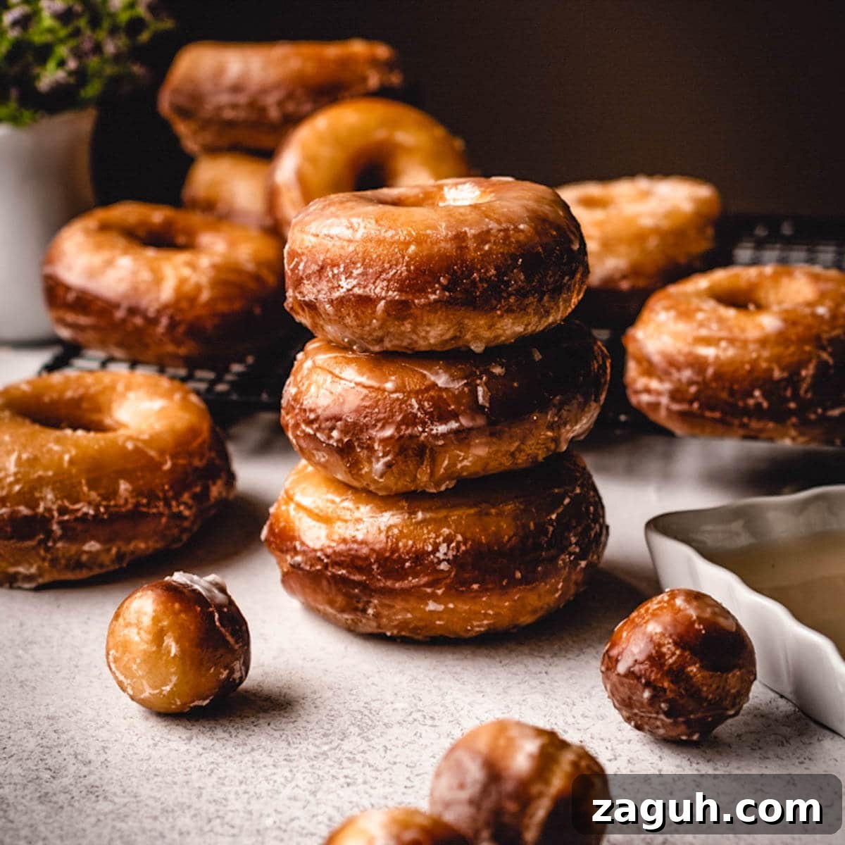 Classic Glazed Donuts: Soft, Shiny, Homemade Recipe 14 Stack of freshly made glazed donuts.
