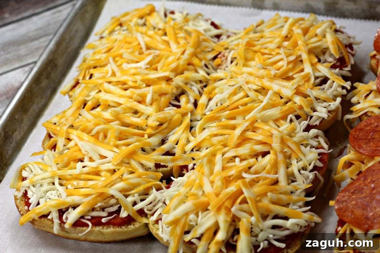 Sheet Pan Pepperoni Sliders Recipe — Quick Party Appetizer 6 Pepperoni Pizza Sliders With Cheese Layer