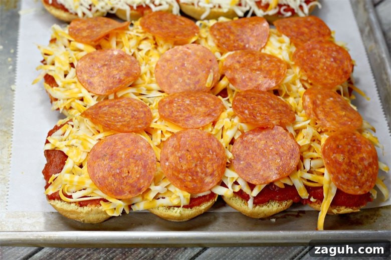 Sheet Pan Pepperoni Sliders Recipe — Quick Party Appetizer 7 Pepperoni Pizza sliders On Sheet Pan
