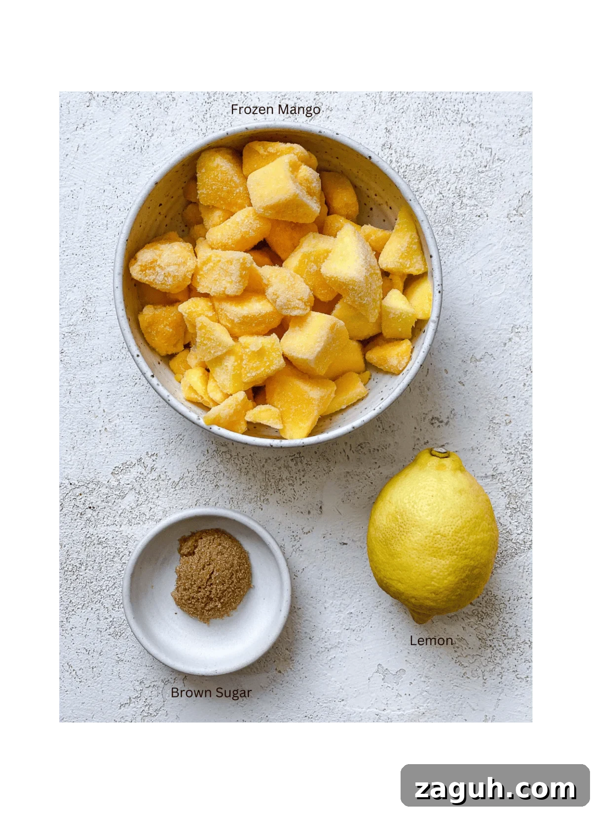3-Ingredient Mango Compote (Simple Coulis Recipe) 3 ingredients for mango compote against a white surface