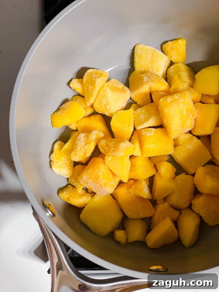 3-Ingredient Mango Compote (Simple Coulis Recipe) 4 mangos in a pot