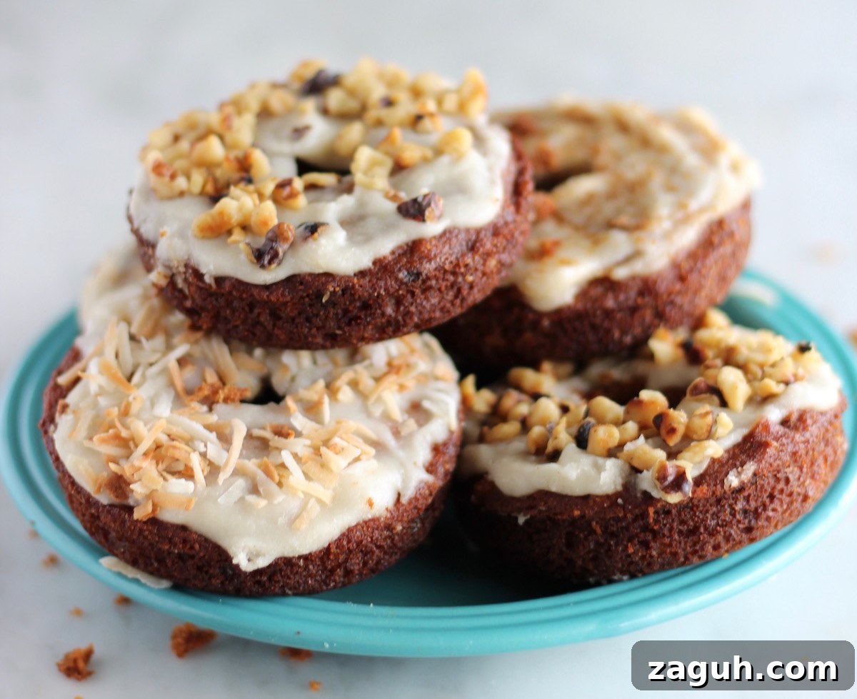 Paleo Carrot Cake Donuts - soft, glazed donuts meet carrot cake in this heavenly combination! | fedandfulfilled.com