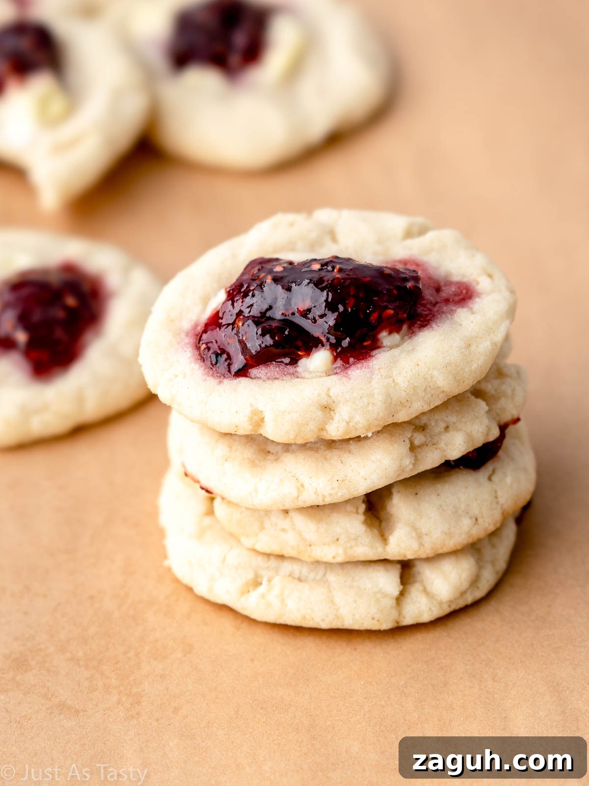 Soft Gluten-Free Raspberry Thumbprint Cookies 4 Stack of raspberry thumbprint cookies.