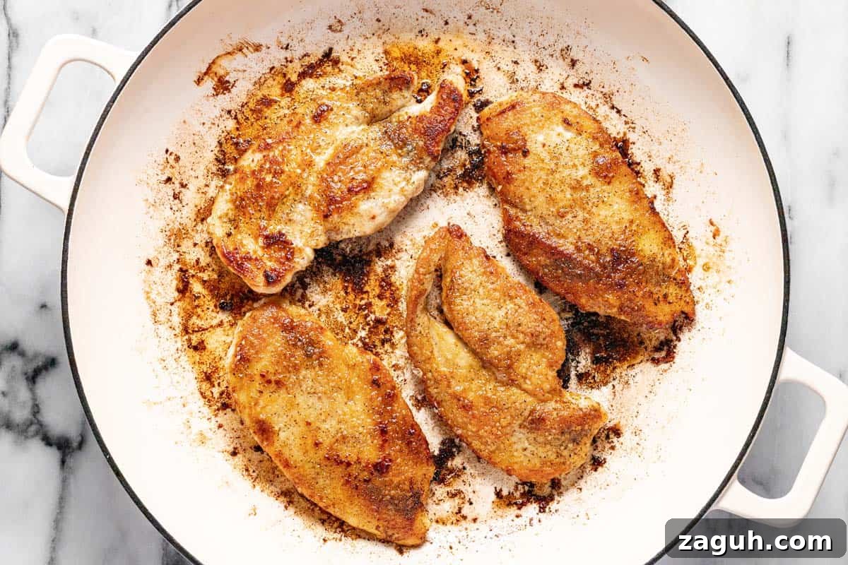 20-Minute Garlic Chicken with Honey Glaze 5 Large pan filled with sauteed chicken breast.