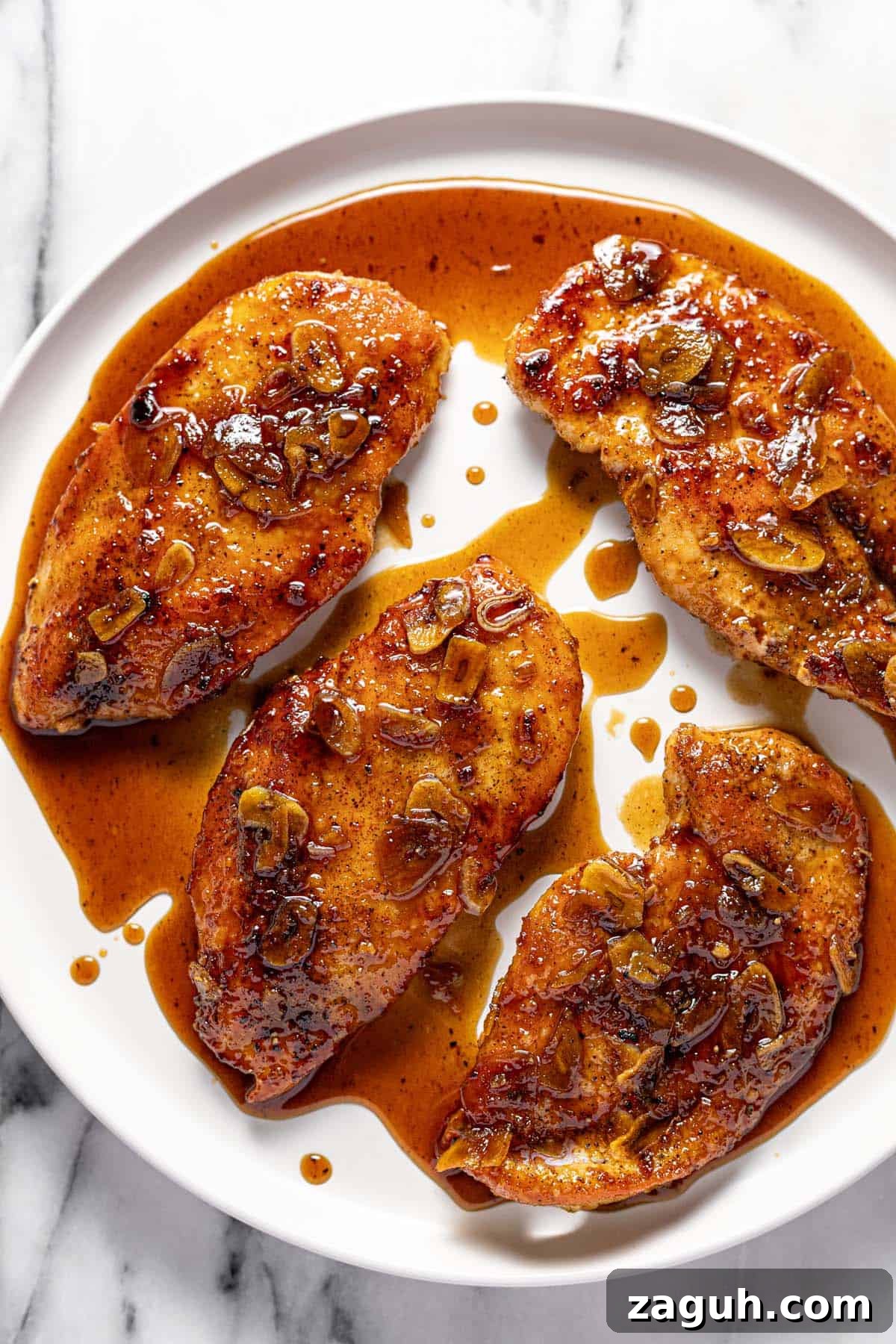 20-Minute Garlic Chicken with Honey Glaze 9 Large round plate with honey garlic chicken breast.