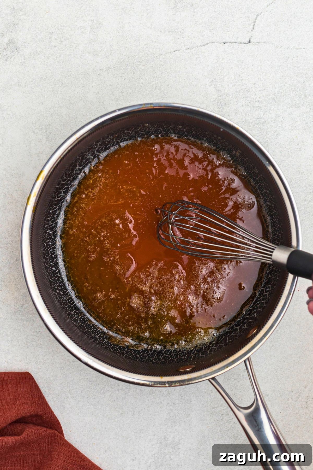 Classic Buffalo Sauce Recipe: Spicy Wing & Dip Sauce in Minutes 4 Sauce in a pan with melted butter and other ingredients.