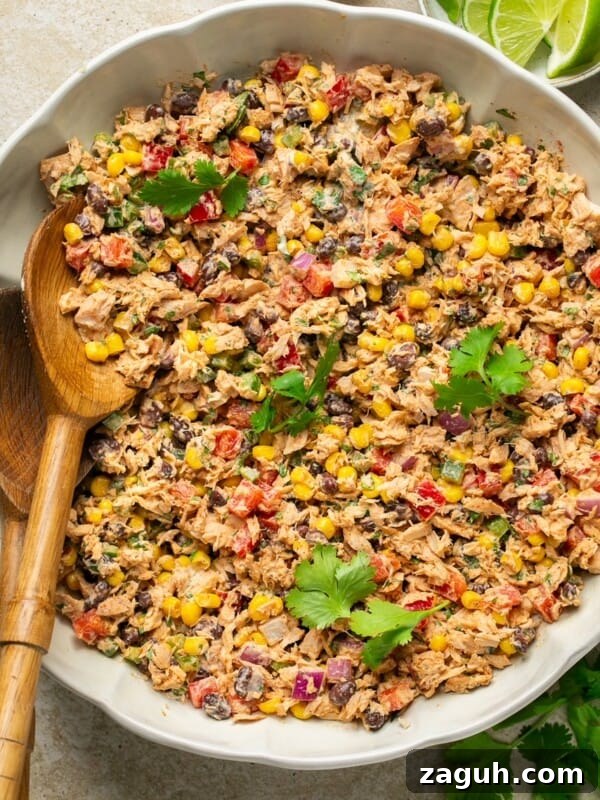 Mexican Tuna Salad in a bowl with a serving spoon