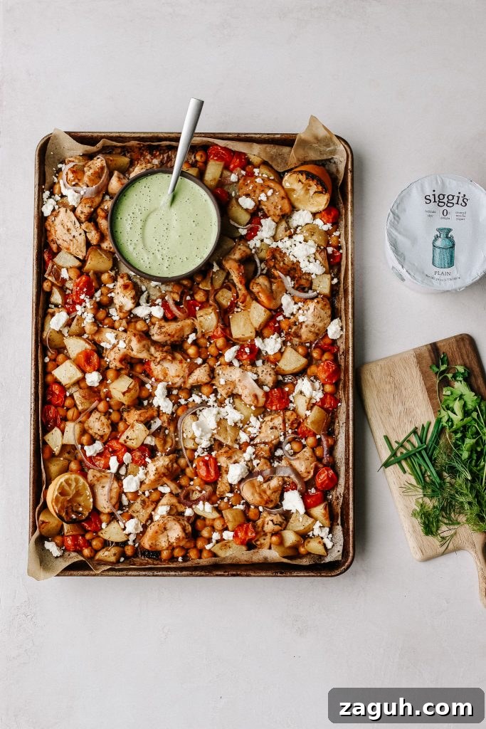 Green Goddess Sheet-Pan Chicken with Roasted Veggies 5 chicken and veggies on sheet pan with green yogurt sauce