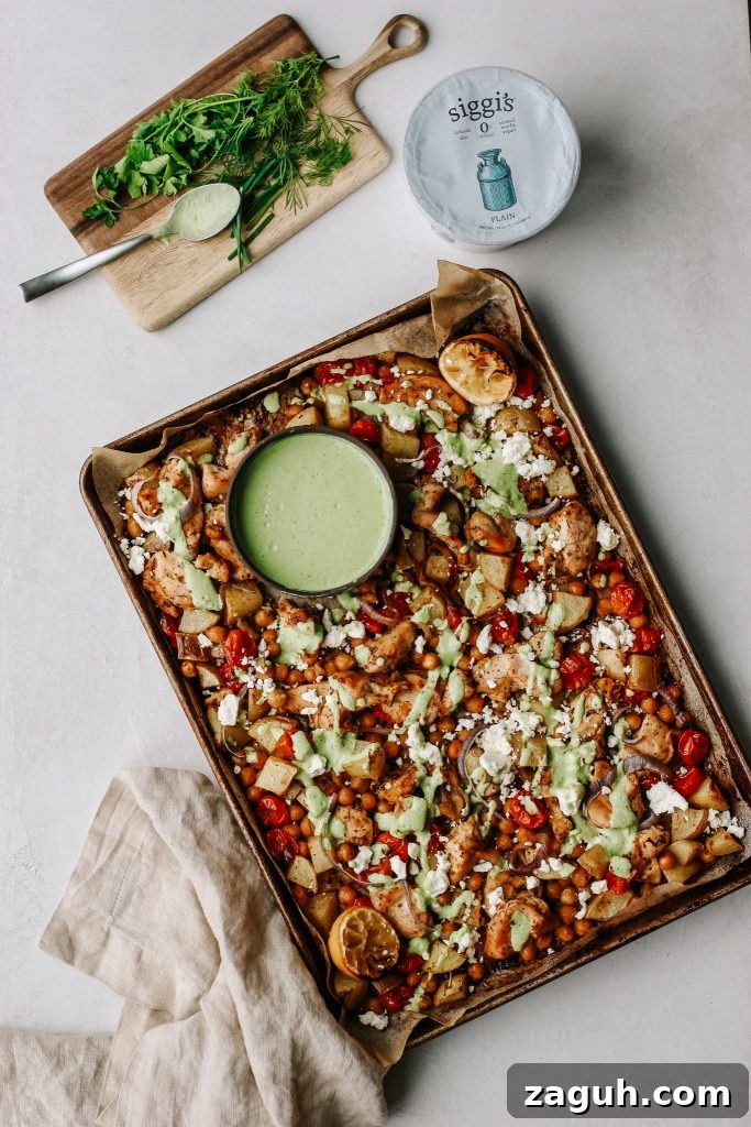 Green Goddess Sheet-Pan Chicken with Roasted Veggies 6 chicken and veggies on sheet pan with green yogurt sauce