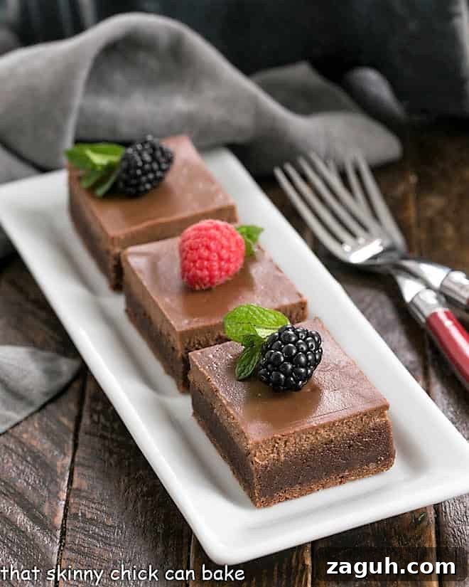Chocolate Cheesecake Brownies - a rich brownie topped with a layer of dreamy chocolate cheesecake Chocolate Cheesecake Brownies on a white rectangular tray