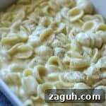close up of white cheddar macaroni and cheese in casserole dish