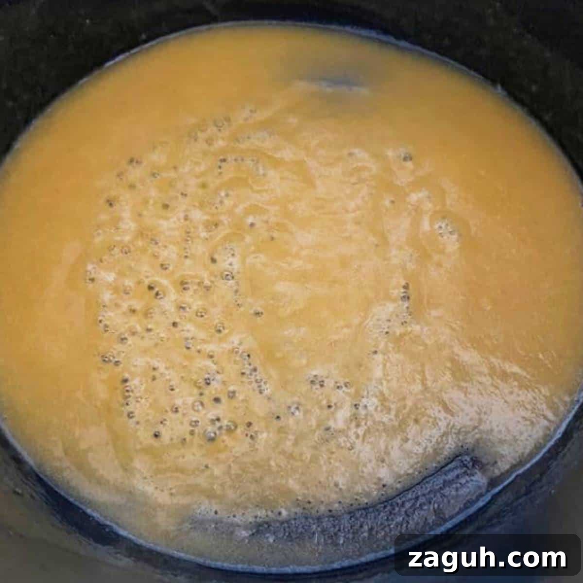 Creamy White Cheddar Mac and Cheese Recipe for Dinner 5 Roux cooking in skillet.