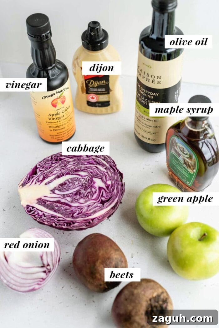 Crisp Apple and Beet Slaw Recipe for Fresh, Tangy Sides 3 Labelled ingredients for a beet, apple and cabbage salad.