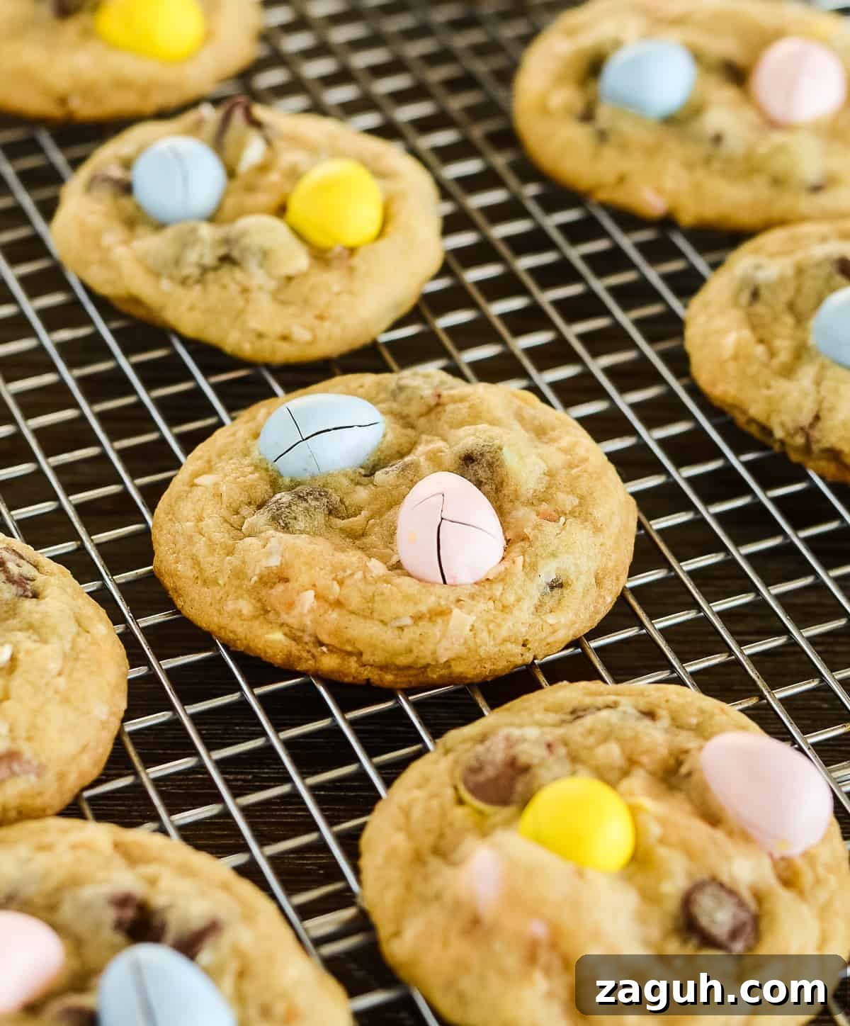 Mini Cadbury Egg Cookies Recipe — Bite-Sized Easter Treats 4 mini cadbury egg cookies on a cooling rack