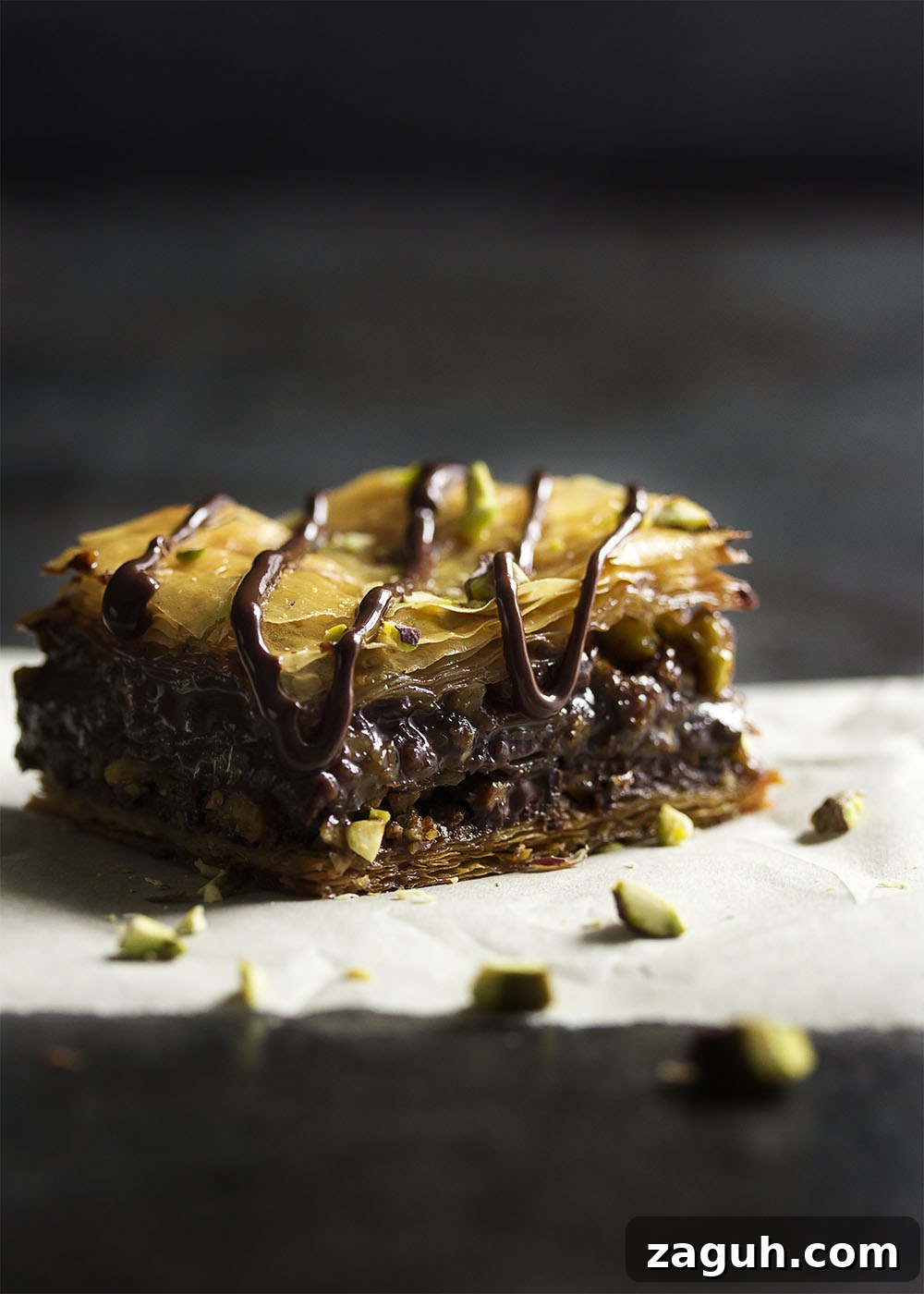 Pistachio Chocolate Baklava: Decadent Layered Dessert Recipe 2 This chocolate baklava is packed full of pistachios and bittersweet chocolate, then drizzled with a honey syrup to make a wonderfully rich Greek dessert.