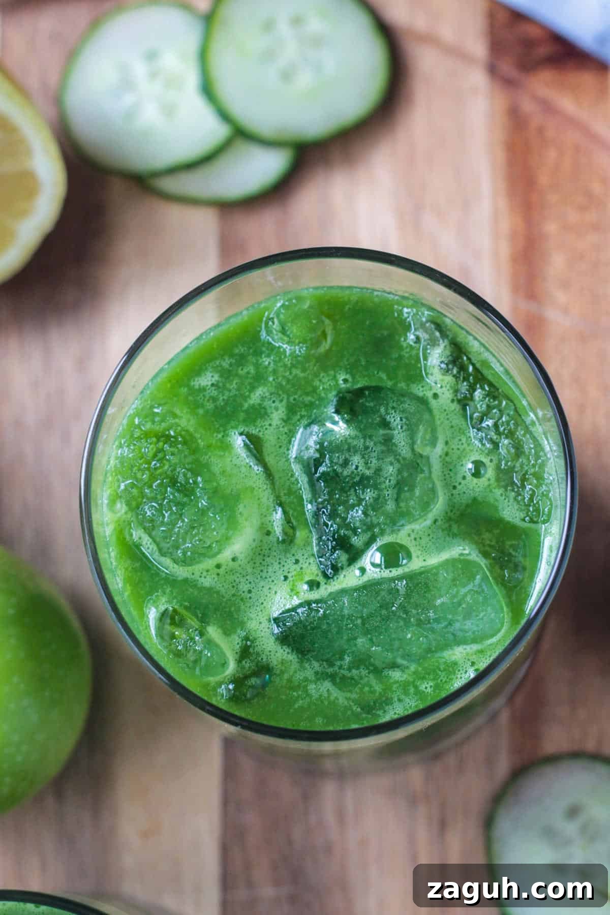 Fresh Green Blender Juice Recipe for Energy and Detox 5 Overhead view of a glass of green blender juice with ice.