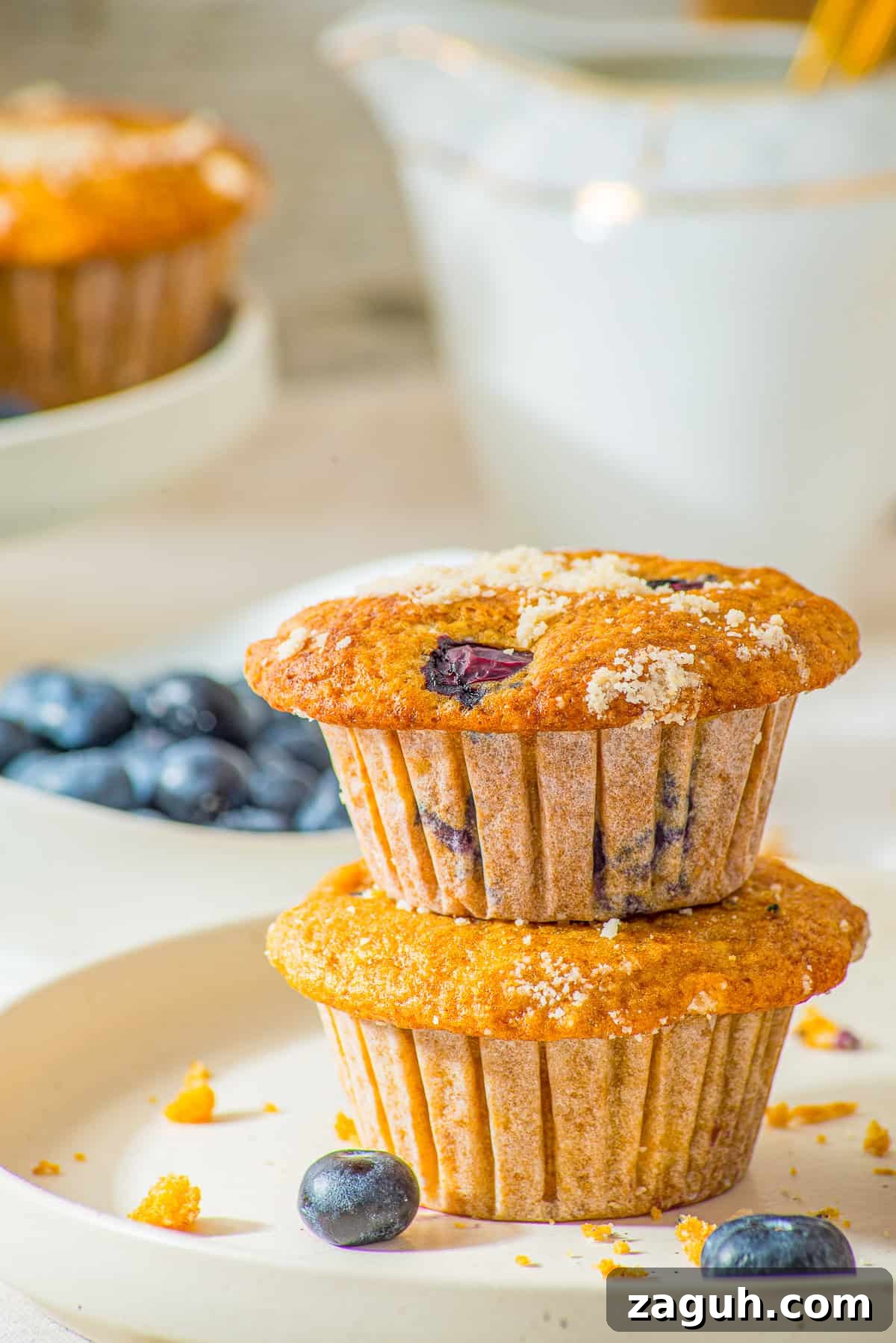 Gluten free blueberry cottage cheese muffins cooling on a wire rack.