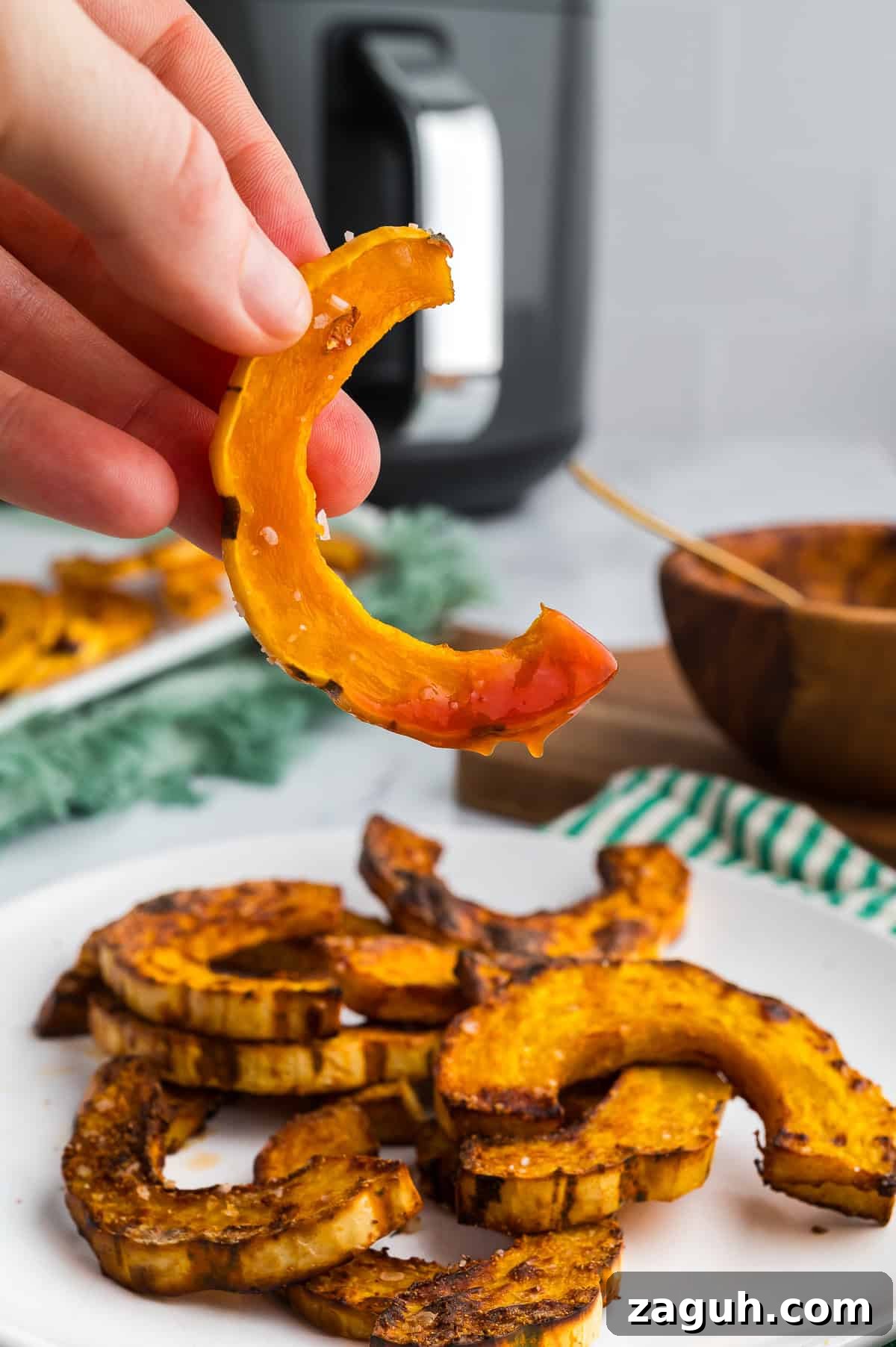 Roasted delicata squash dipped in ketchup.