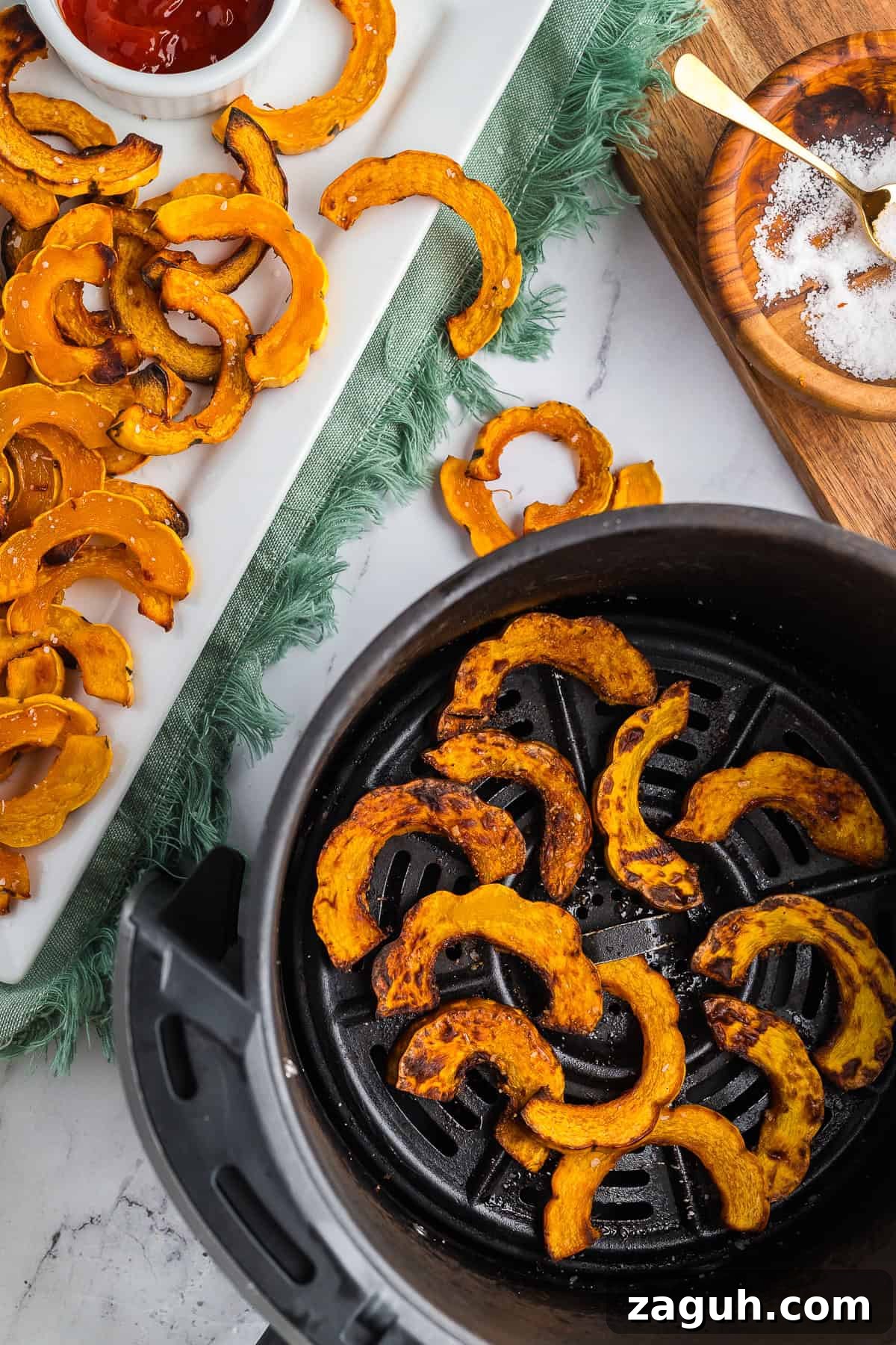 Crispy Air Fryer Delicata Squash on a marble countertop.