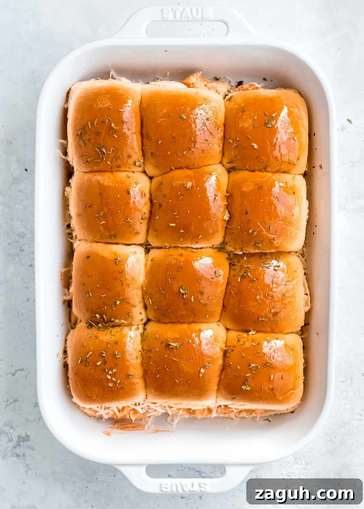 Spicy Buffalo Chicken Sliders with Blue Cheese Slaw 12 baked buffalo chicken sliders topped with herbs