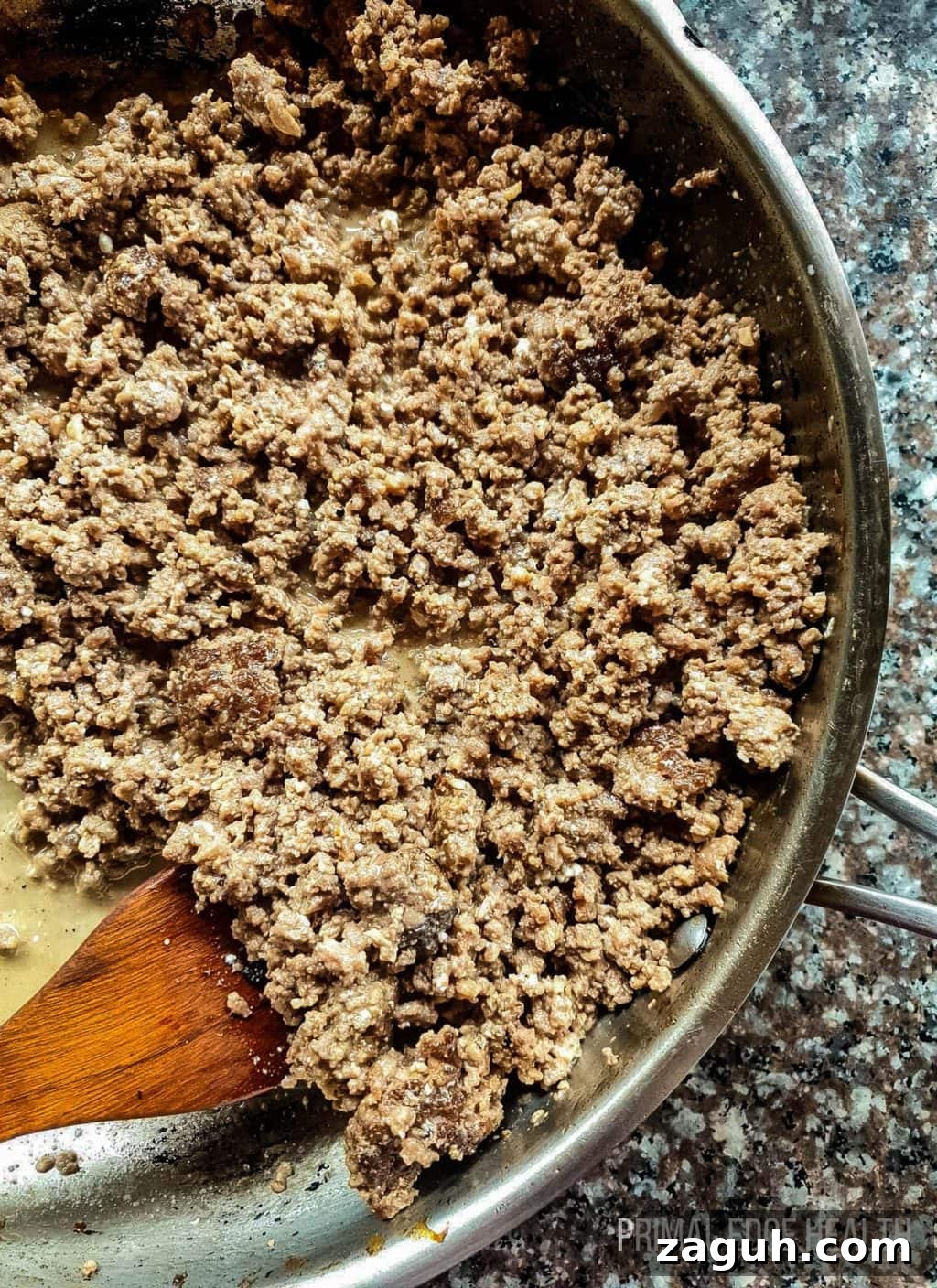 Carnivore Lunch Ideas for Simple Weekly Meal Planning 2 Ground beef in a pan with a wooden spoon.