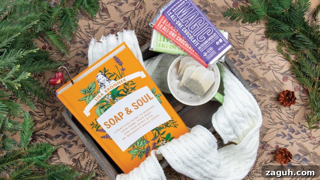 Soap & Soul-Inspired Themed Gift Baskets for Every Occasion 2 Soap & Soul book with tea, Dr. Bronner's Magic Chocolate and greenery.