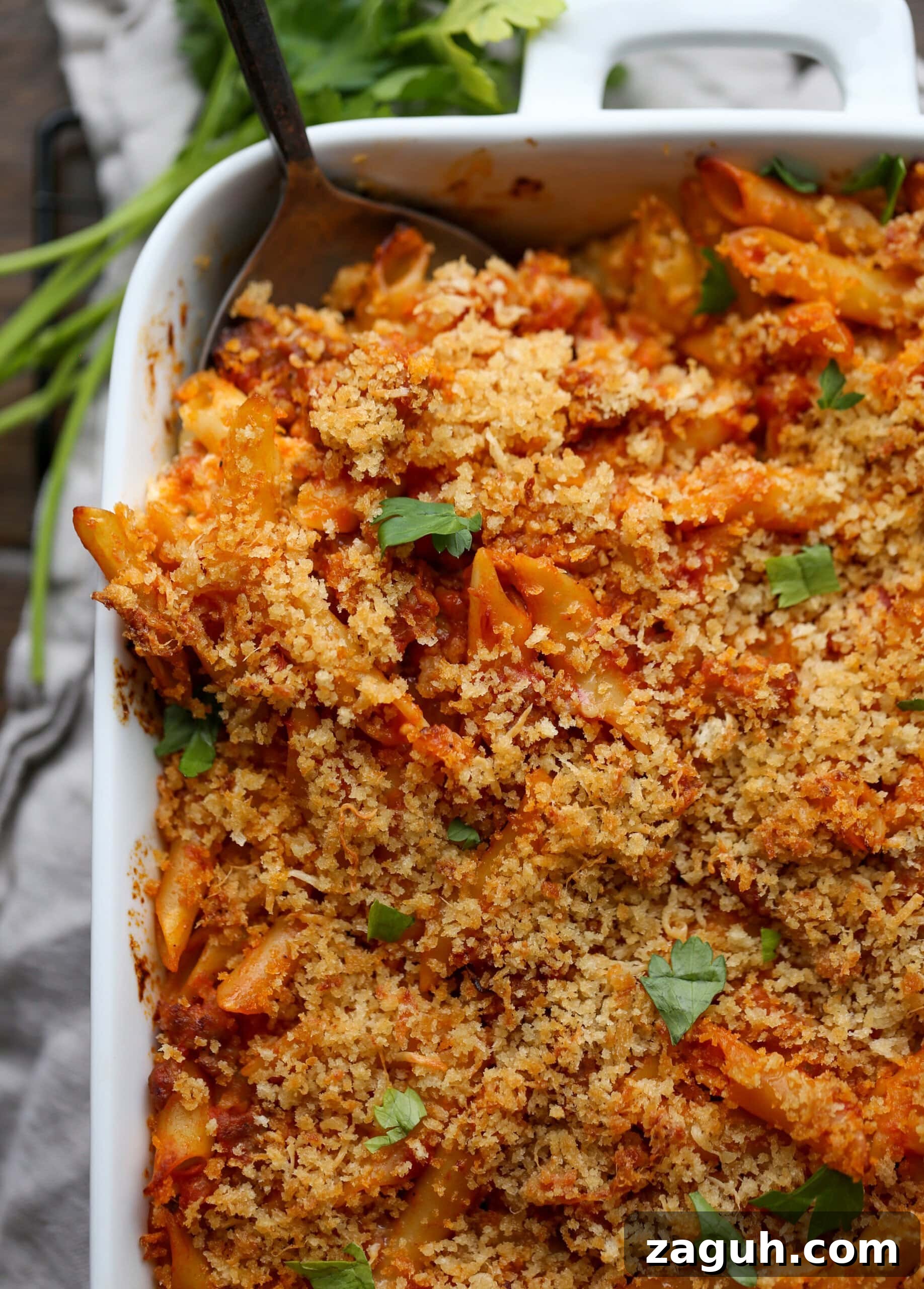 Creamy Baked Mostaccioli with Melted Cheese 3 Baked mostaccioli topped with parmesan cheese, breadcrumbs and fresh herbs.