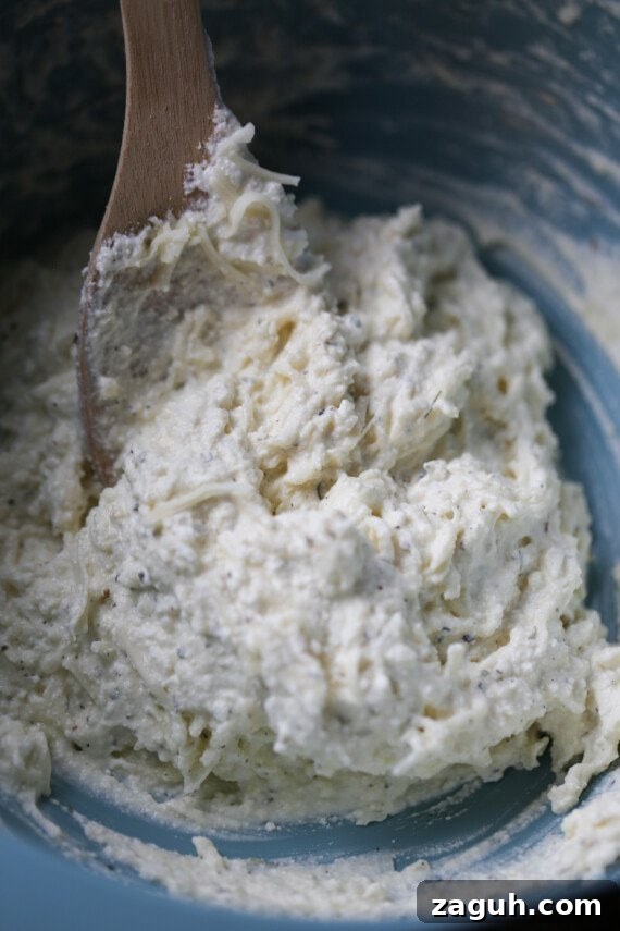 Creamy Baked Mostaccioli with Melted Cheese 7 The ricotta cheese mixture is stirred together for the baked mostaccioli.