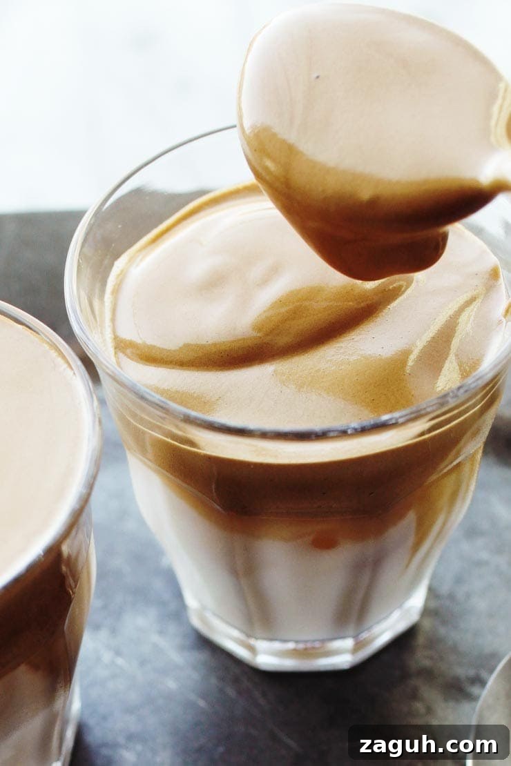 Creamy Dalgona Coffee Recipe: Whipped Instant Coffee at Home 13 Pouring Coffee