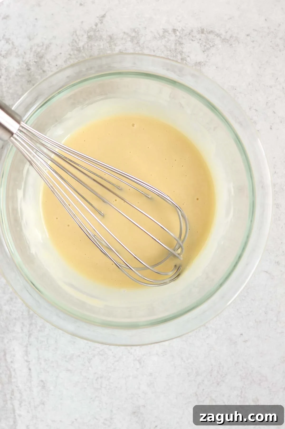 Creamy Paleo & Whole30 Coleslaw Recipe for Simple Sides 4 Coleslaw dressing being whisked in a mixing bowl.