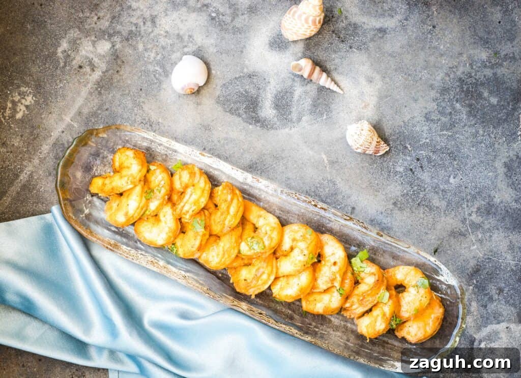 31 Bold Seafood Recipes for Big Flavor with Simple Ingredients 13 Two pans of smoked shrimp on a table.