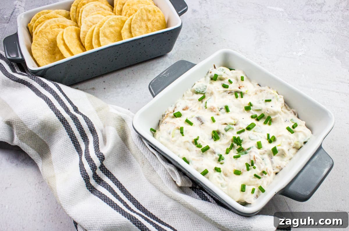 31 Bold Seafood Recipes for Big Flavor with Simple Ingredients 14 A bowl of cold crab dip with crackers and chives.