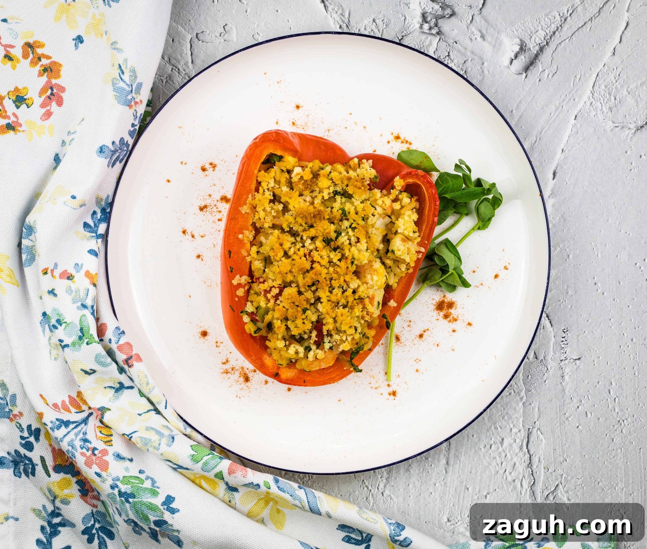 31 Bold Seafood Recipes for Big Flavor with Simple Ingredients 18 Stuffed red peppers on a white plate.
